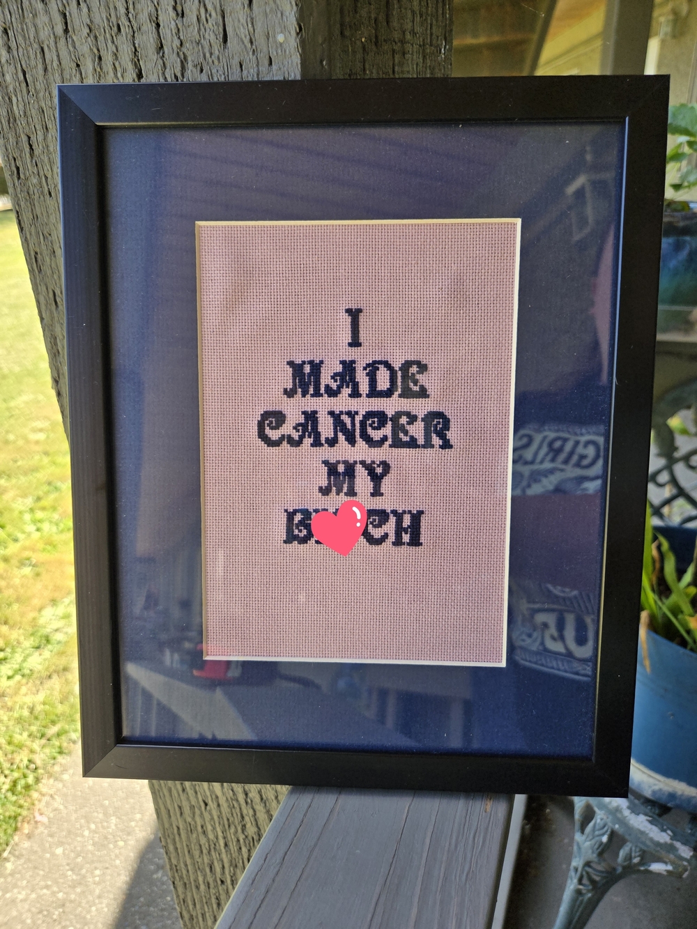 Framed Cross-Stitch Saying on Pink Fabric